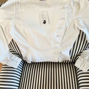 Woman’s white shirt. New with tag. Side buttons/cuff buttons. Size 6 bust34 B-C
